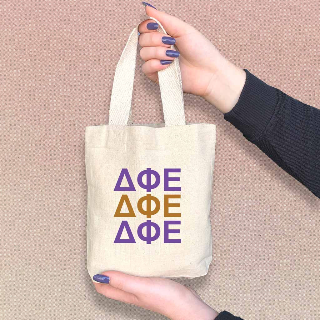 Delta Phi Epsilon sorority letters in sorority colors digitally printed on the perfect mini size natural canvas tote bag.