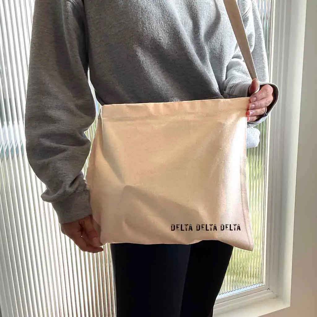 Crafted from durable canvas, each spacious bag features the Delta Delta Delta name digitally printed on both sides in the lower corner. Perfect for all your essentials, this carry-all silhouette is a fantastic gift idea and a favorite for chapter orders and big-little gifts