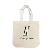 Delta Gamma small canvas tote bag featuring striped Delta Gamma Greek letters on a white background