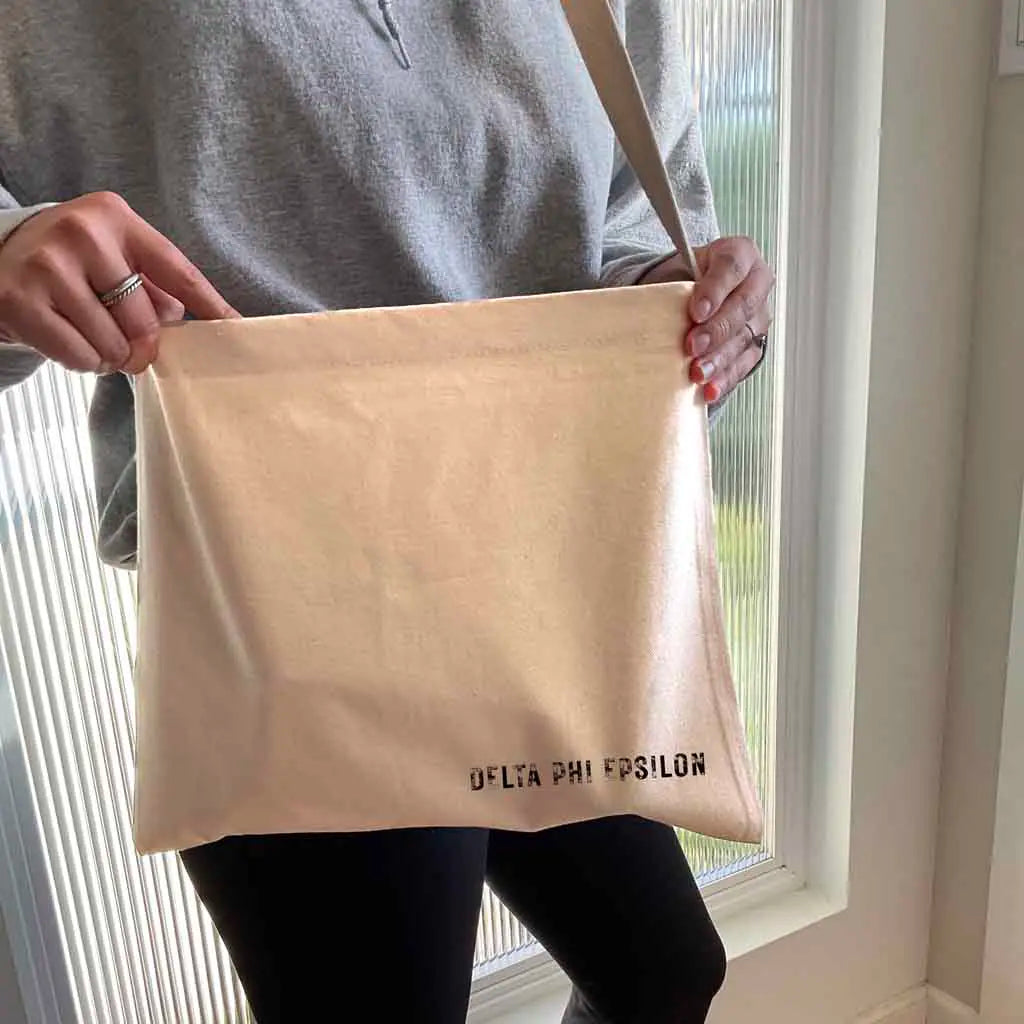 Crafted from durable canvas, each spacious bag features the Delta Phi Epsilon name digitally printed on both sides in the lower corner. Perfect for all your essentials, this carry-all silhouette is a fantastic gift idea and a favorite for chapter orders and big-little gifts.