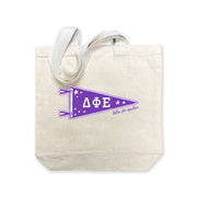 Delta Phi Epsilon collegiate pennant medium size canvas tote bag featuring DPhiE Greek letters on a white background