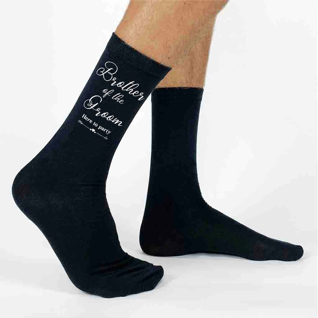 Wedding party socks with fun saying, here to party, for the brother of the groom digitally printed on the outside of the cotton socks.