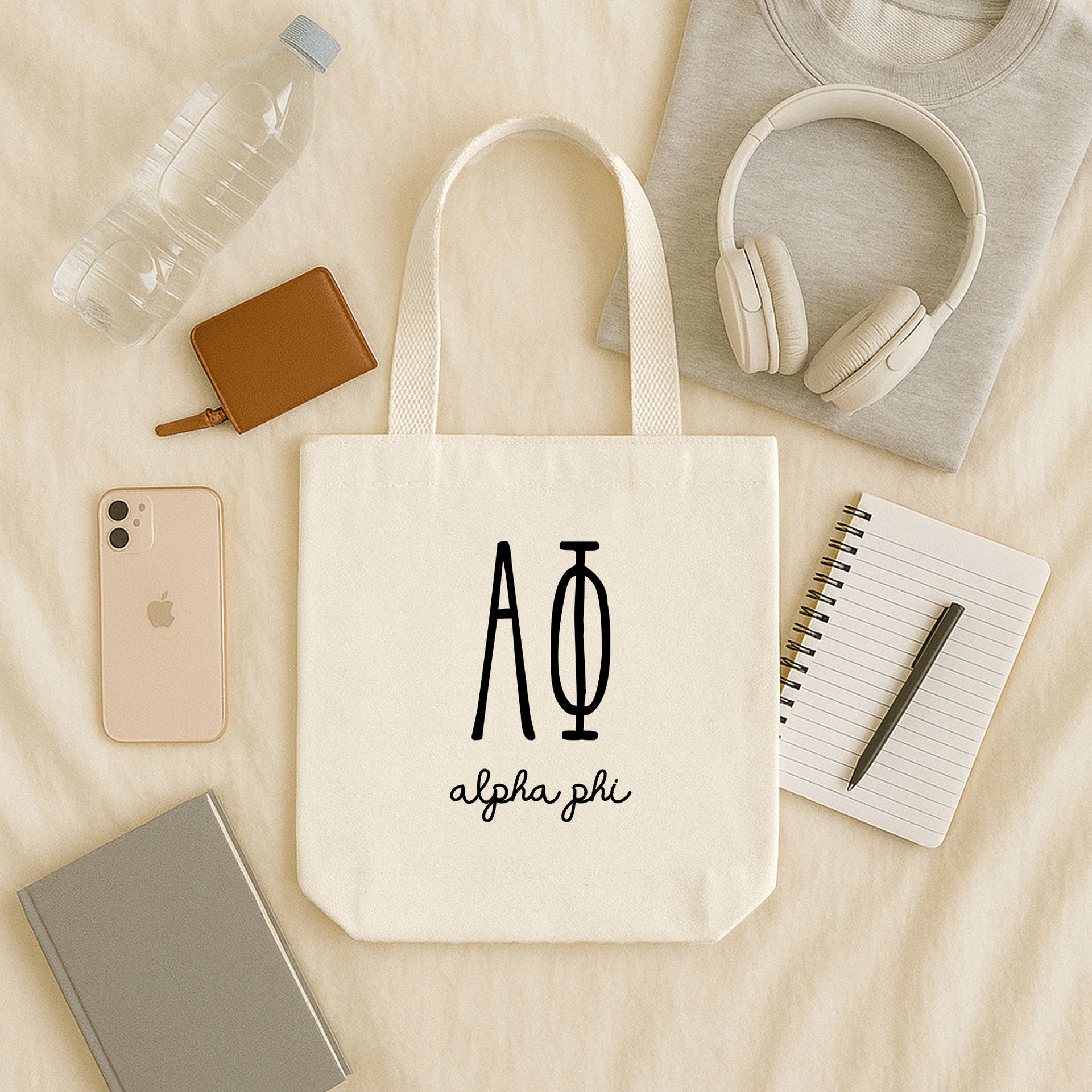 Alpha Phi lifestyle image of a sorority woman using her Alpha Phi tote during a sisterhood brunch or event.