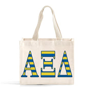 Front view of Alpha Xi Delta Greek letters in sorority colors small striped tote bag