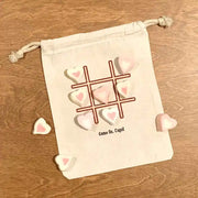 Tic Tac Toe design digitally printed on goodie bags with cute sayings for valentines sold in a four pack assortment.