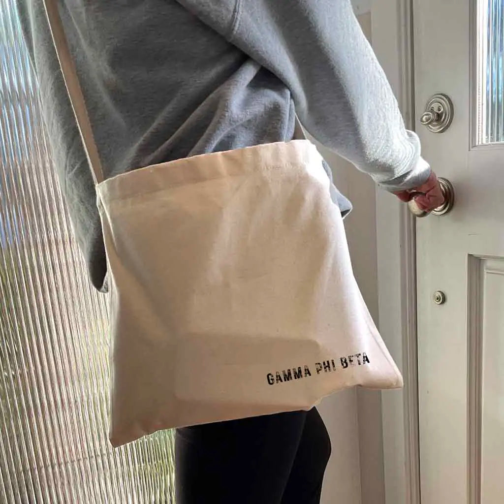 Crafted from durable canvas, each spacious bag features the Gamma Phi Beta name digitally printed on both sides in the lower corner. Perfect for all your essentials, this carry-all silhouette is a fantastic gift idea and a favorite for chapter orders and big-little gifts.