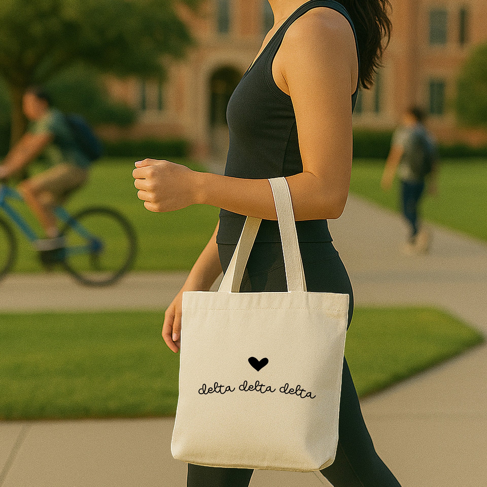 Delta Delta Delta Greek letters with heart printed on a canvas tote bag used for a Big/Little reveal.