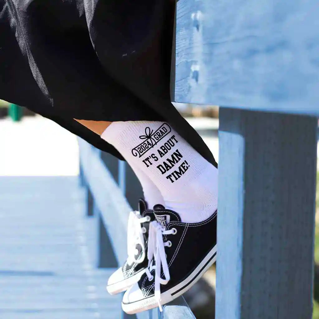 Funny 2024 graduation gift socks custom printed with class of 2024 ITS ABOUT DAMN TIME printed on the outsides of both socks make a great gift for your graduating senior.