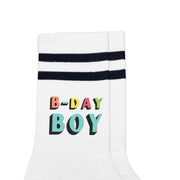 Fun Birthday boy socks digitally printed on the outside of white socks with black stripes.
