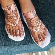 Women’s white no show socks featuring a decorative henna-inspired foot tattoo design