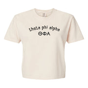 Theta Phi Alpha Comfort Colors boxy crop t-shirt featuring the sorority name and Greek letters design
