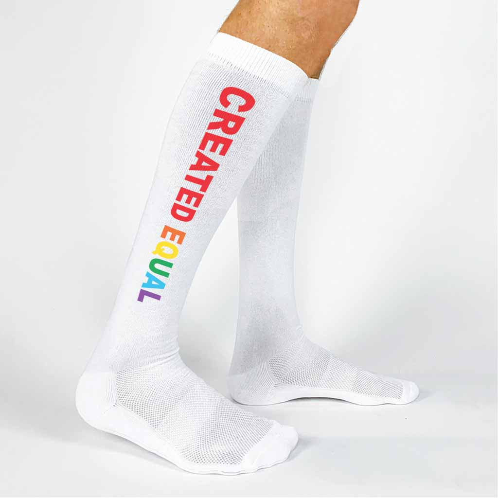 Created equal rainbow design digitally printed on the sides of white cotton knee high socks are perfect to gift to all of your pansexual friends.