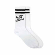 Loud and proud design in black ink digitally printed on white cotton crew socks with black stripes are the perfect accessory to wear to support LGBTQ pride month.