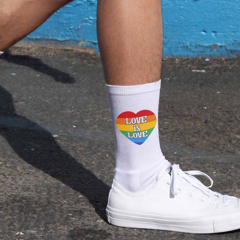 Comfortable and soft white cotton crew socks digitally printed with love is love rainbow crew socks are perfect to support LGBTQ pride month.