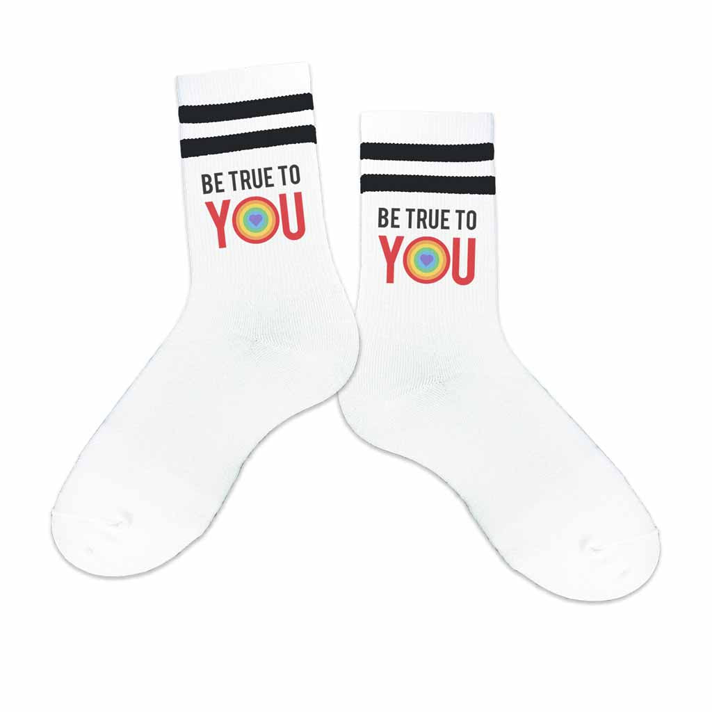 These Be True to You design digitally printed on white cotton crew socks with black stripes are designed to inspire and empower you to embrace your authentic self.