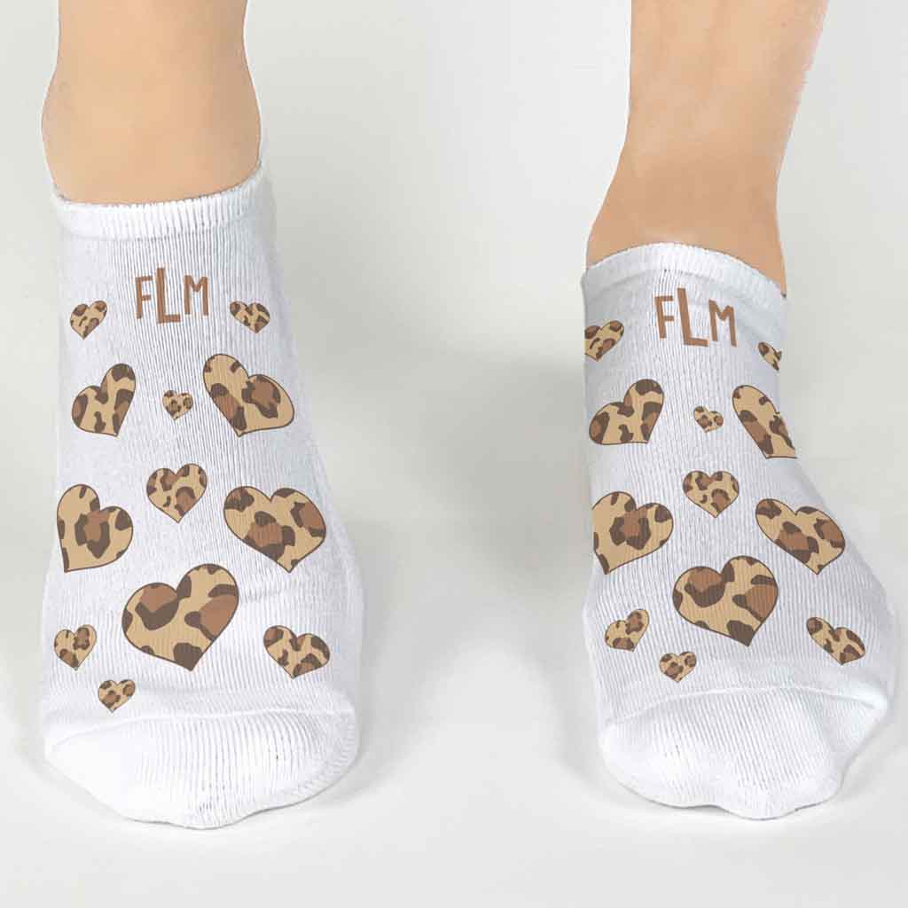 Super cute animal print heart design custom printed on the top of white no show socks and personalized with your monogram initials in a three pair pack gift box set.