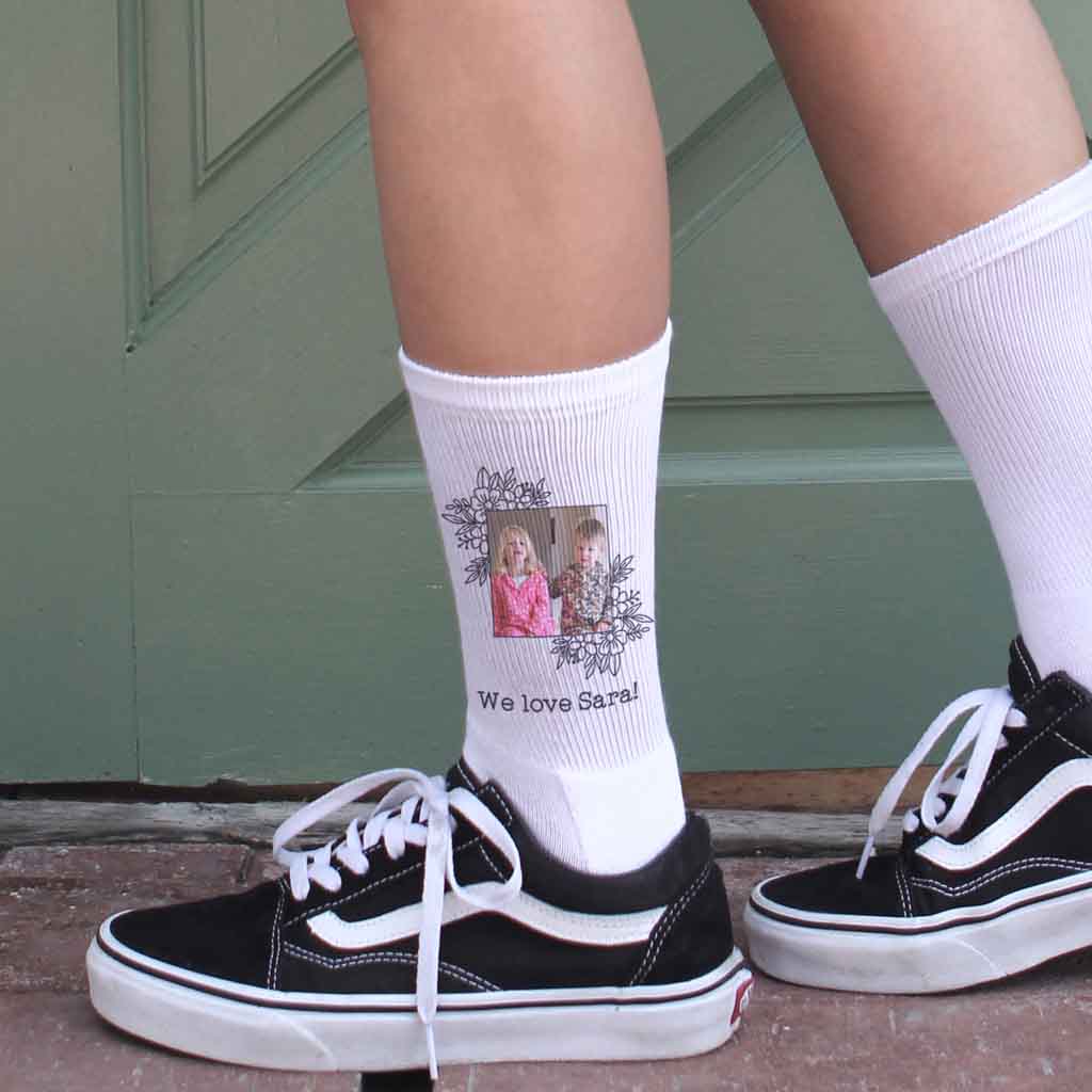 Floral frame design personalized with your photo and custom text digitally printed on white cotton crew socks.
