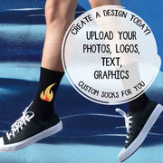 Black customizable unisex crew socks worn by a model, featuring an example design to show how personalized artwork, text, or logos appear when printed.