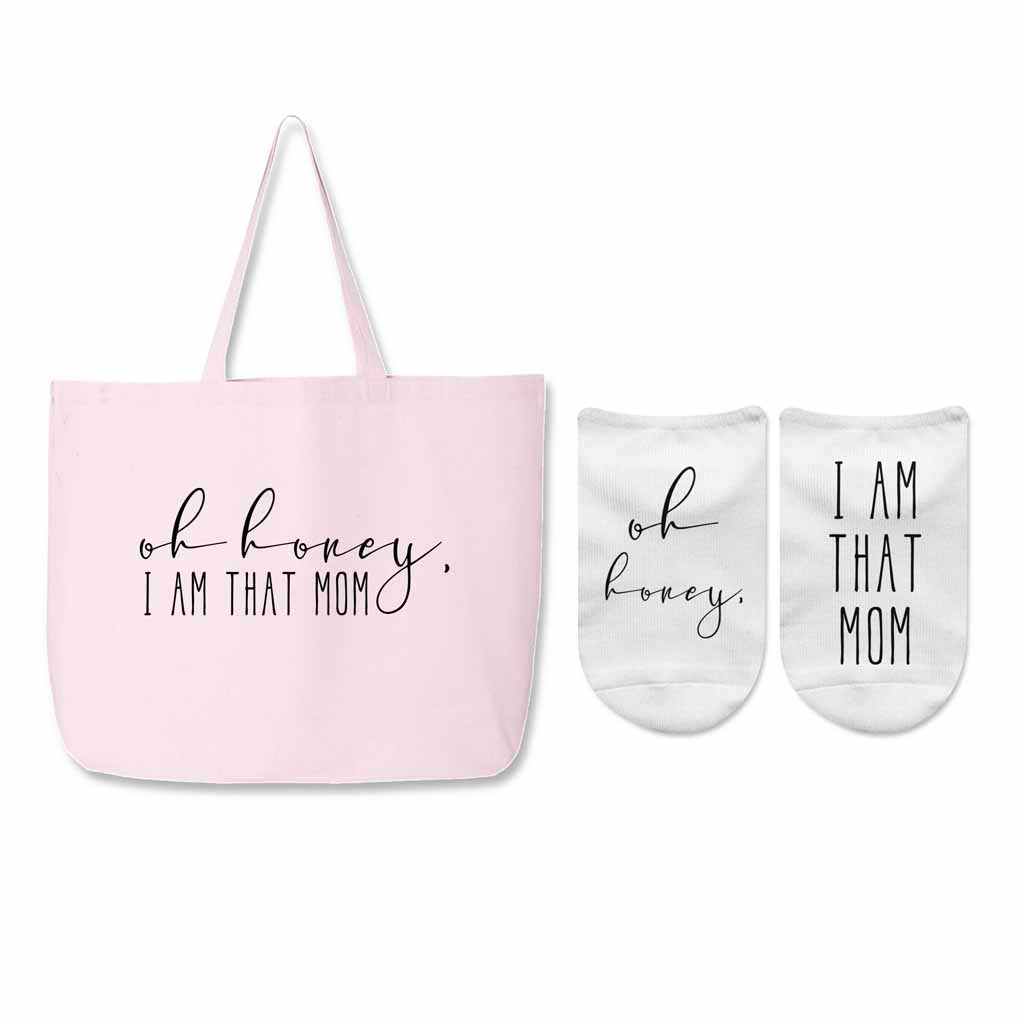 Pink canvas tote with matching socks with the saying "oh honey, I am that mom"