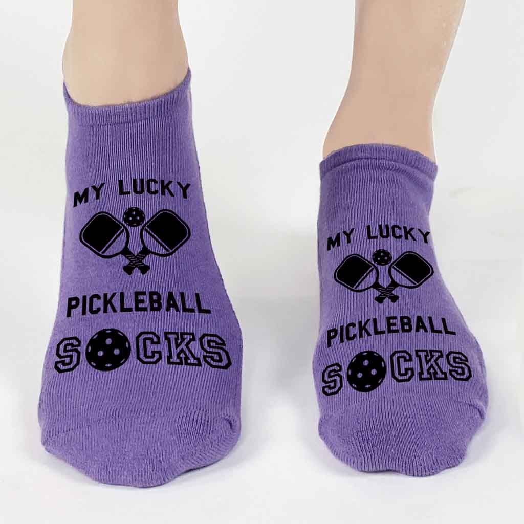 These 3 pack pickleball socks for her are sure to be a hit at your next tournament or party! Included is this pair of purple no show footie pickleball socks with the saying "my lucky pickleball socks" and cute graphic in black ink. 