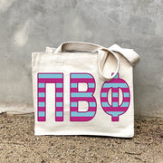 PBP Black Stripe Tote in front of a gray wall