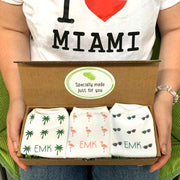 Personalized socks in a three pair gift box set digitally printed with a beachy monogram design.