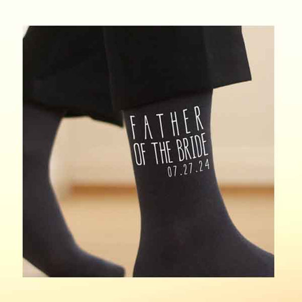 personalized socks for the father of the bride and the father of the groom are the perfect accessory for the wedding day. Add the wedding date to the wedding design to personalize the pair.
