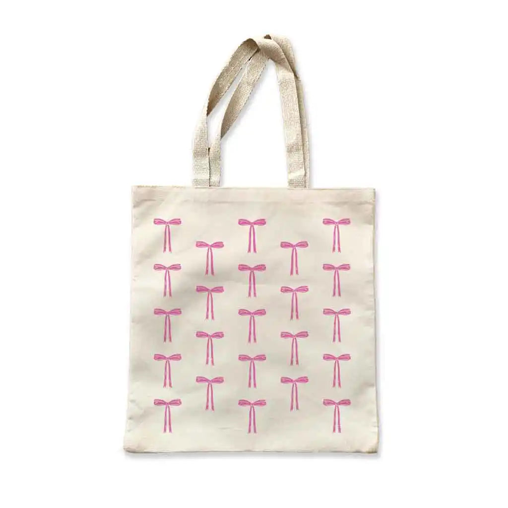 This stylish shoulder tote features a step and repeat pattern of a coquette bow, available in 6 fun fashion colors.