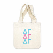 Delta Gamma sorority letters digitally printed in sorority colors on natural canvas mini tote gift bag.