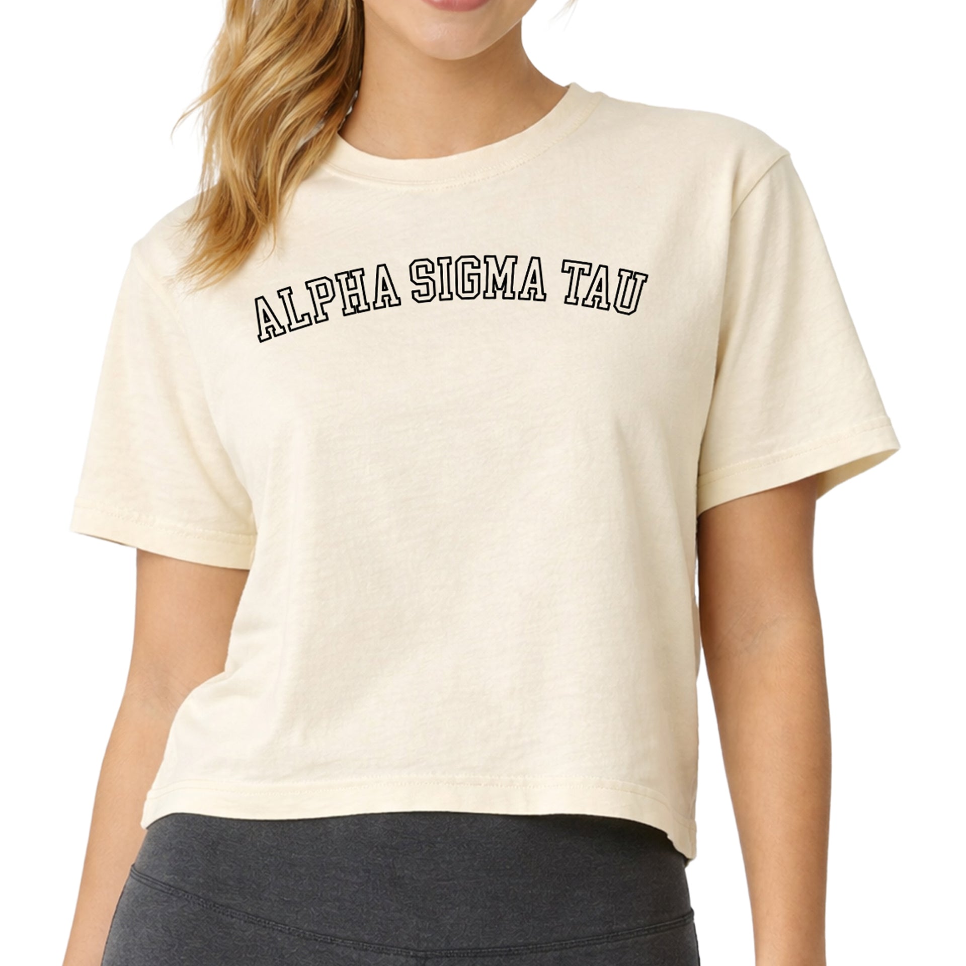 Alpha Sigma Tau woman wearing an officially licensed Comfort Colors boxy crop t-shirt featuring the AST sorority nickname design