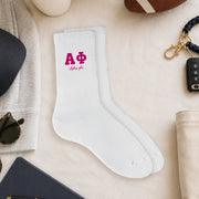 Alpha Phi crew socks styled in a sorority flat lay with Greek life accessories and campus-inspired décor