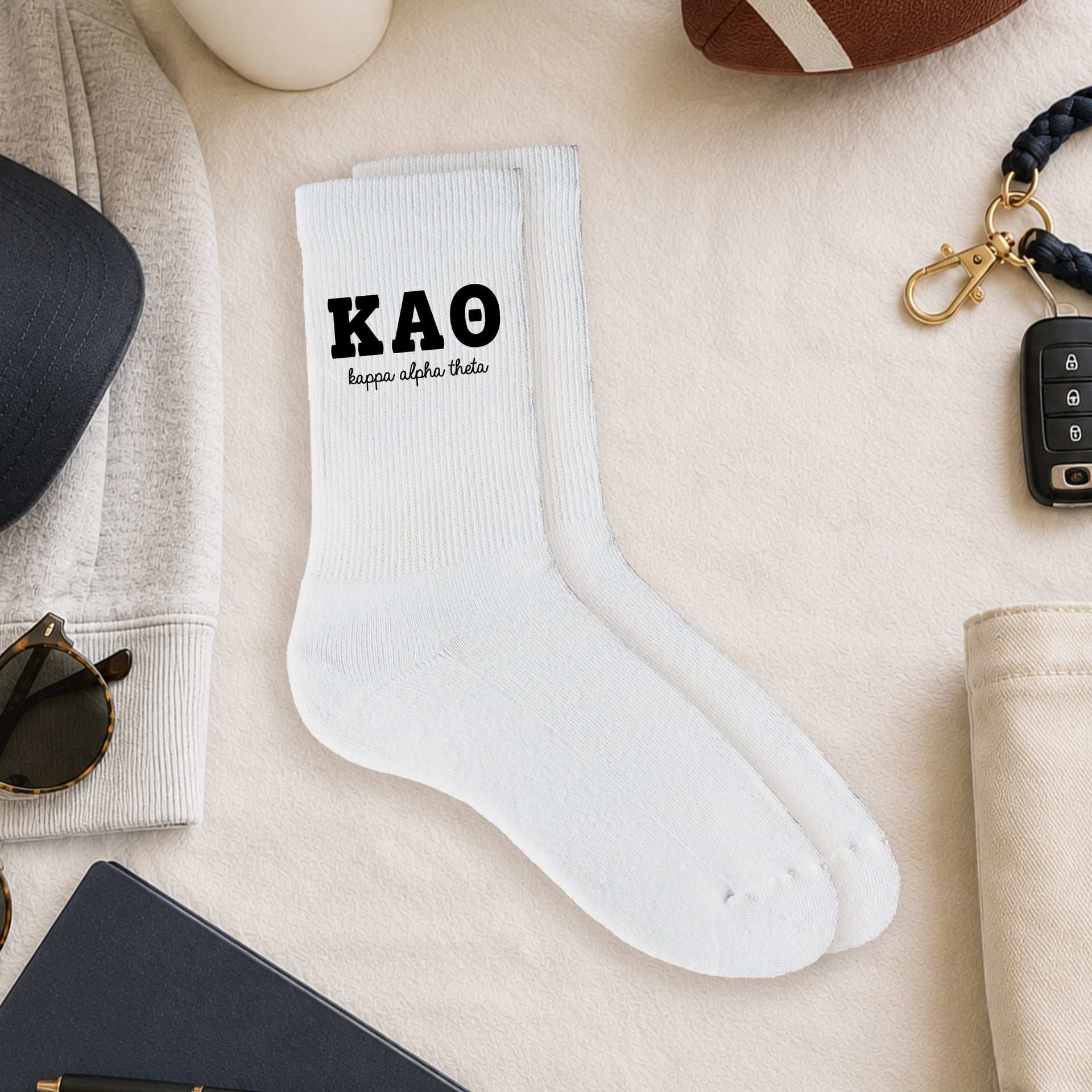 Kappa Alpha Theta crew socks styled in a sorority flat lay with Greek life accessories and campus-inspired décor