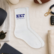 Kappa Kappa Gamma crew socks styled in a sorority flat lay with Greek life accessories and campus-inspired décor