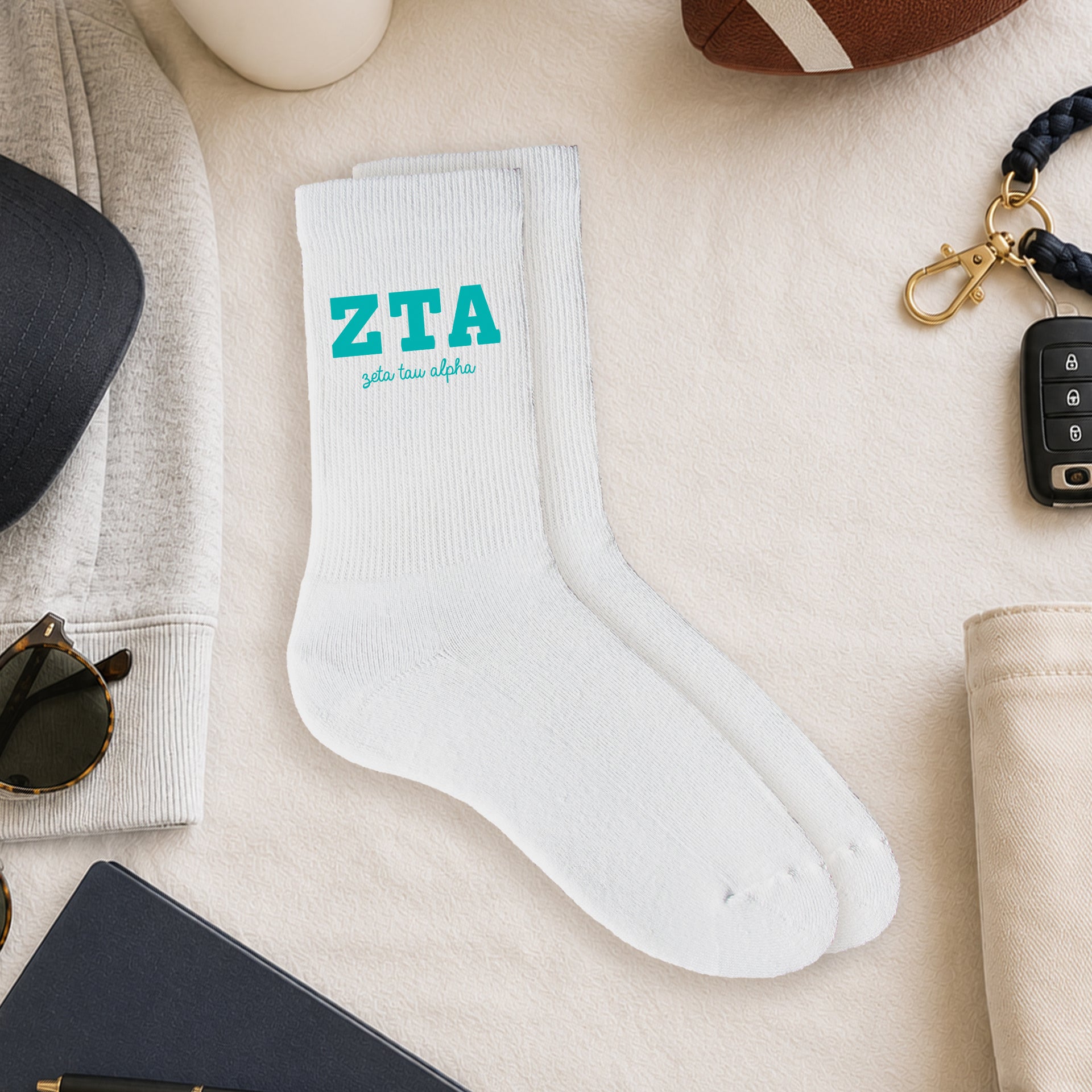 Zeta Tau Alpha crew socks styled in a sorority flat lay with Greek life accessories and campus-inspired décor