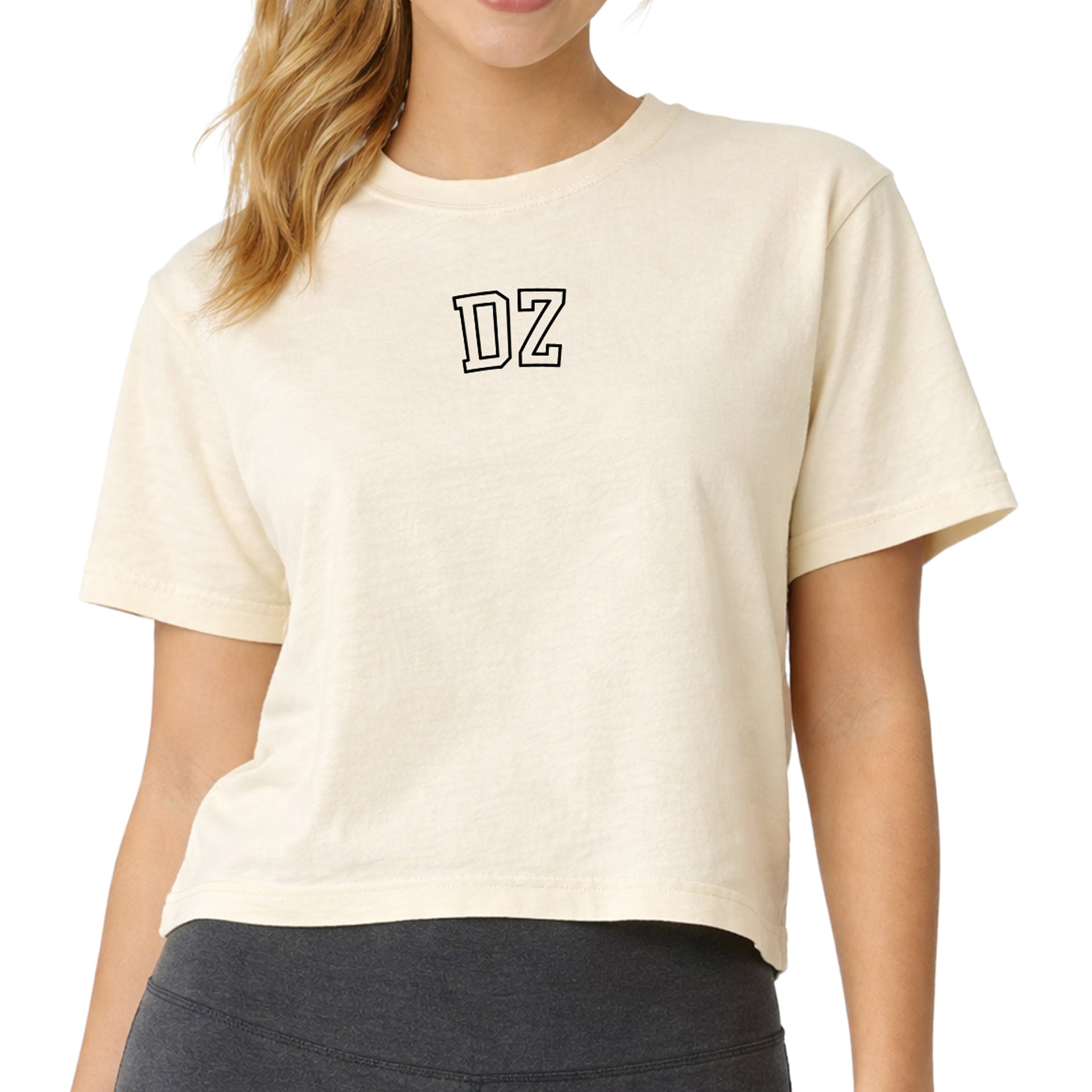 Delta Zeta woman wearing an officially licensed Comfort Colors boxy crop t-shirt featuring the DZ sorority nickname design