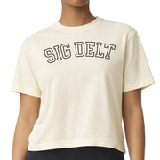 Sigma Delta Tau woman wearing an officially licensed Comfort Colors boxy crop t-shirt featuring the SDT sorority nickname design