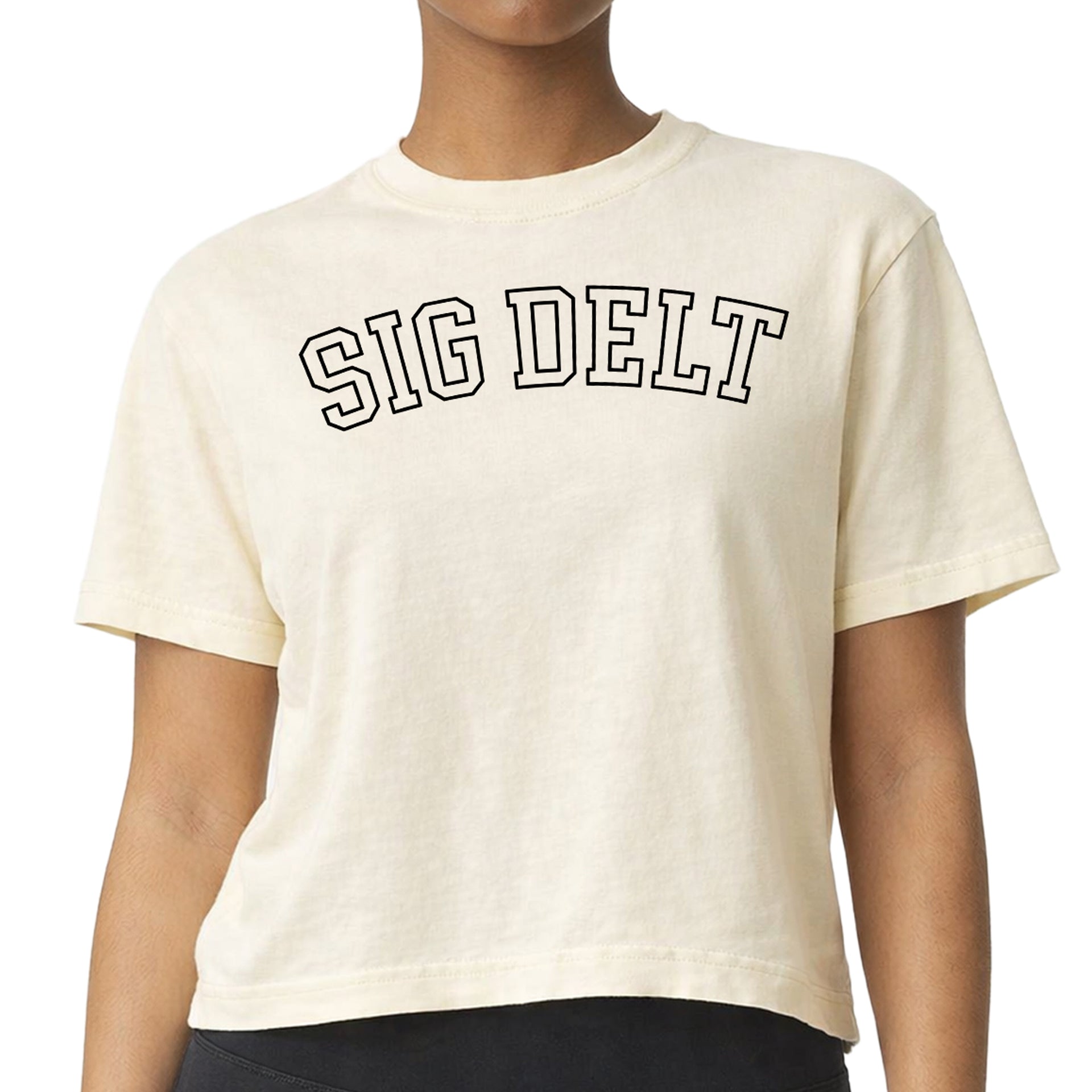 Sigma Delta Tau woman wearing an officially licensed Comfort Colors boxy crop t-shirt featuring the SDT sorority nickname design