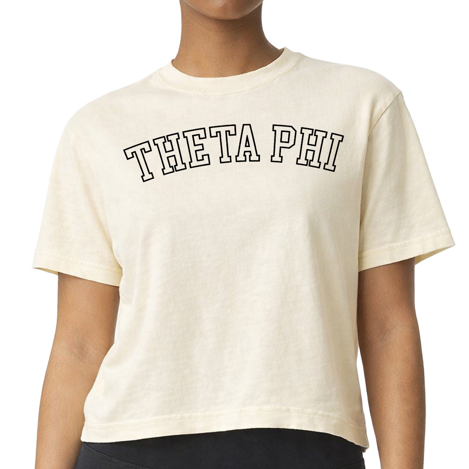 Theta Phi Alpha woman wearing an officially licensed Comfort Colors boxy crop t-shirt featuring the Theta Phi sorority nickname design
