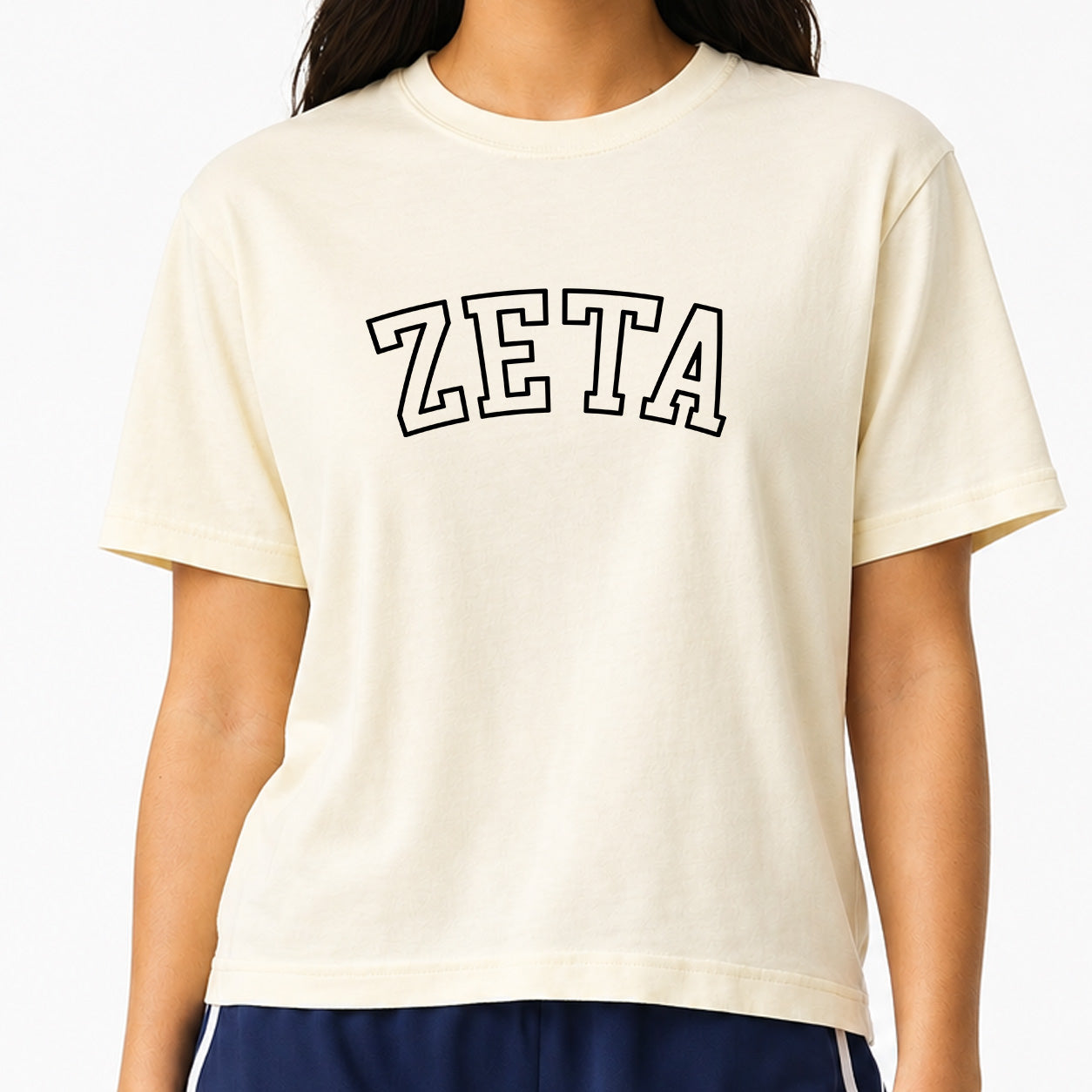 Woman wearing a Zeta Tau Alpha Comfort Colors boxy crop t-shirt featuring the sorority name in block letters 
