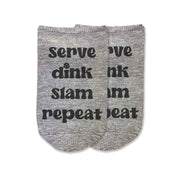 These 3 pack pickleball socks for her are sure to be a hit at your next tournament or party! Included is this pair of gray no show footie pickleball socks with the saying "serve, dink slam, repeat" in black ink! 