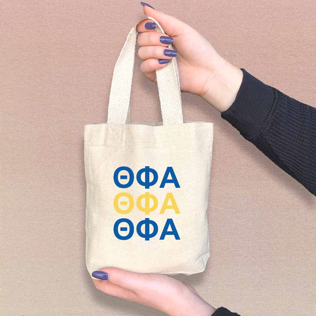 Theta Phi Alpha sorority letters in sorority colors digitally printed on the perfect mini size natural canvas tote bag.