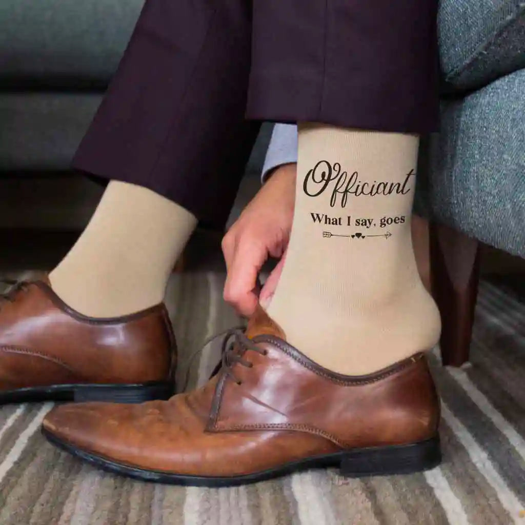 Funny wedding socks for the officiant make a great gift for the one who seals the deal. Shown on tan dress socks.