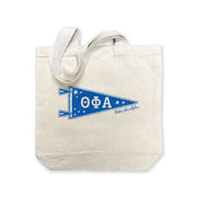 Theta Phi Alpha collegiate pennant medium size canvas tote bag featuring Theta Phi Alpha Greek letters on a white background
