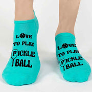 These 3 pack pickleball socks for her are sure to be a hit at your next tournament or party! Included is this pair of teal no show footie pickleball socks with the saying "love to play pickleball" in black ink. 
