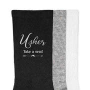 Fun wedding party socks for the usher with take a seat design printed on the outside of the cotton socks.