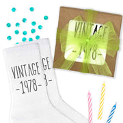 Vintage birthday year socks custom printed on white cotton crew socks with a gift box.