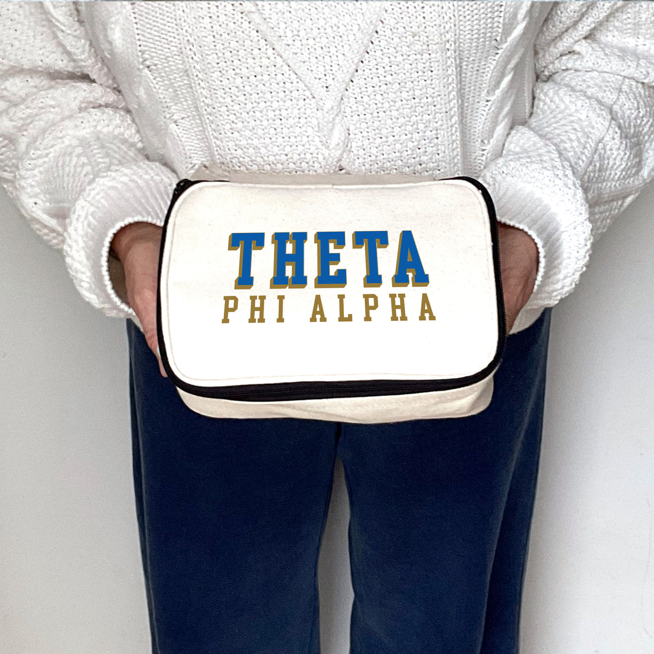 Angled view of Theta Phi Alpha 3D Print Sorority Name Cosmetic Make Up Bag showcasing 3D lettering