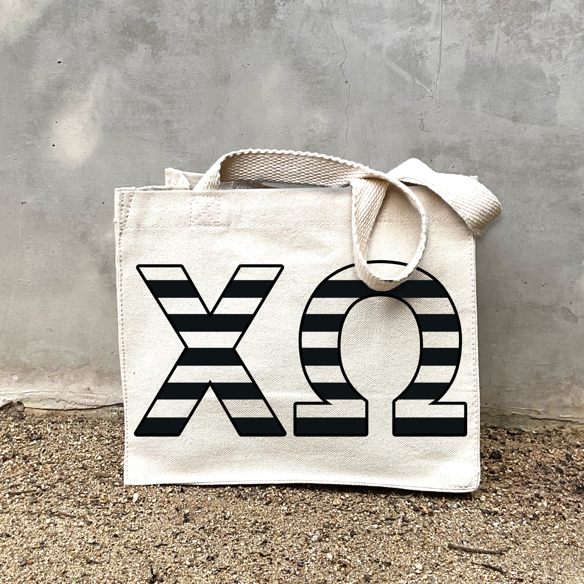 Front view of Chi Omega small black and whie stripe tote bag