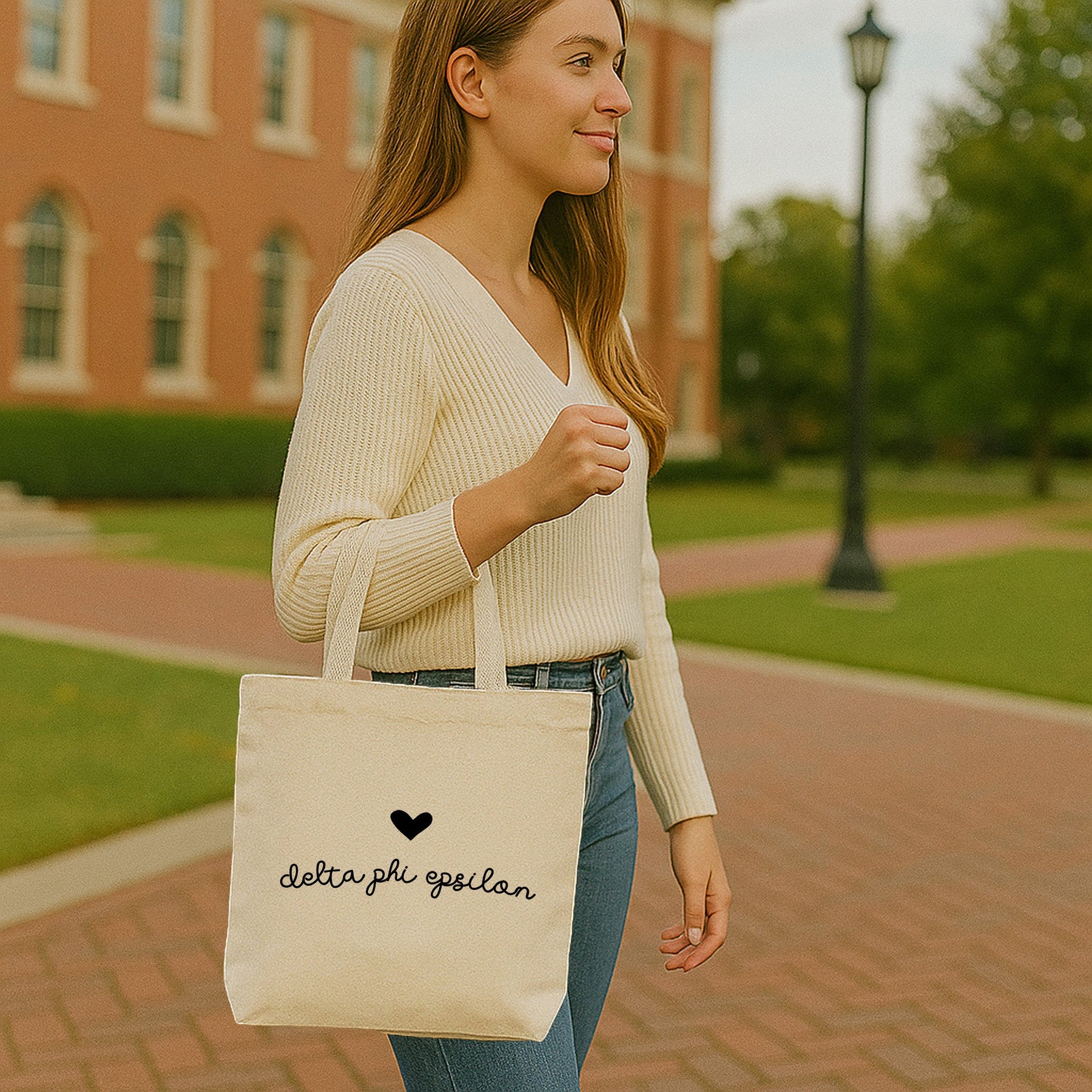 Delta Phi Epsilon heart and DPhiE letters printed on a canvas bag, perfect for chapter events or gifting.