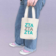 Zeta Tau Alpha sorority letters in sorority colors digitally printed on the perfect mini size natural canvas tote bag.
